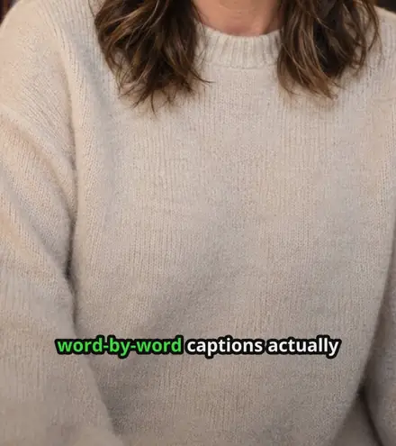 A frame of captioned video in the Punch style, with the words "word-by-word captions actually" across the lower third and the current word highlighted